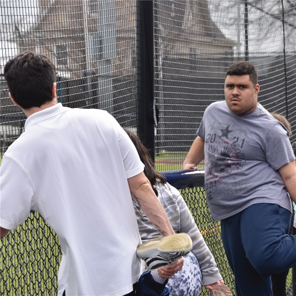  Students stretching at track and field practice.